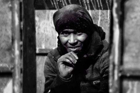 Professional Portraits - Black and white of ethnic male worker in warm clothes during working day in factory